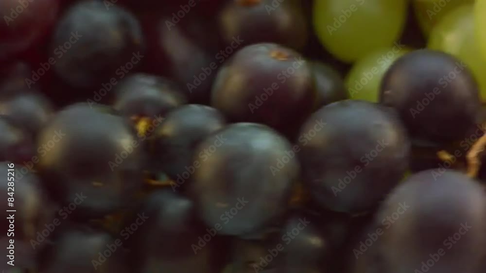 Dizzy spinning Grapes on glass table, pan from right Dizzy spinning Grapes on glass table, pan from right