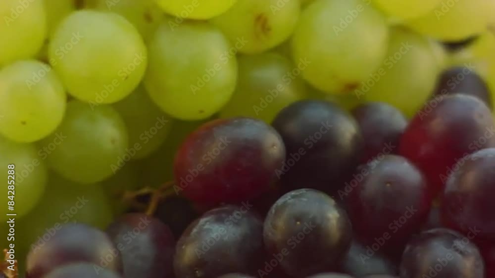 Spinning Grapes on glass table, pan from left Spinning Grapes on glass table, pan from left