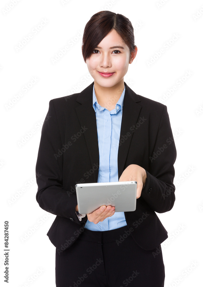 Asian businesswoman use of the tablet pc Asian businesswoman use of the tablet pc
