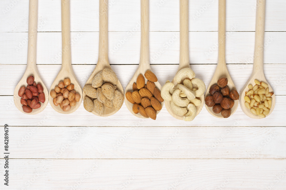 Assorted nuts in spoons Assorted nuts in spoons