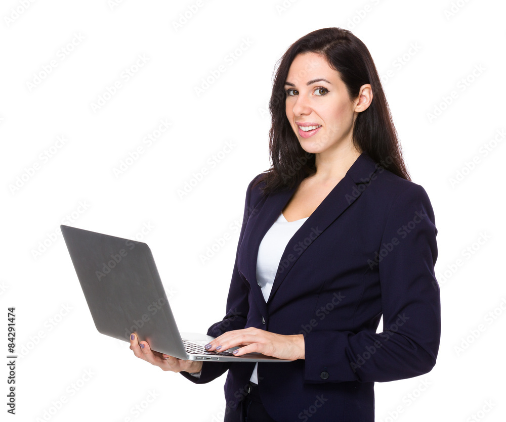 Brunette businesswoman use of laptop computer Brunette businesswoman use of laptop computer