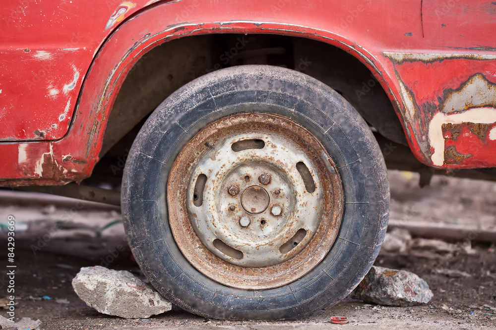 Close-up photo of rusty car wheel