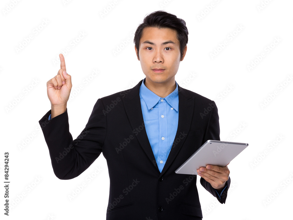 Businessman hold with tablet and finger pointing up Businessman hold with tablet and finger pointing up