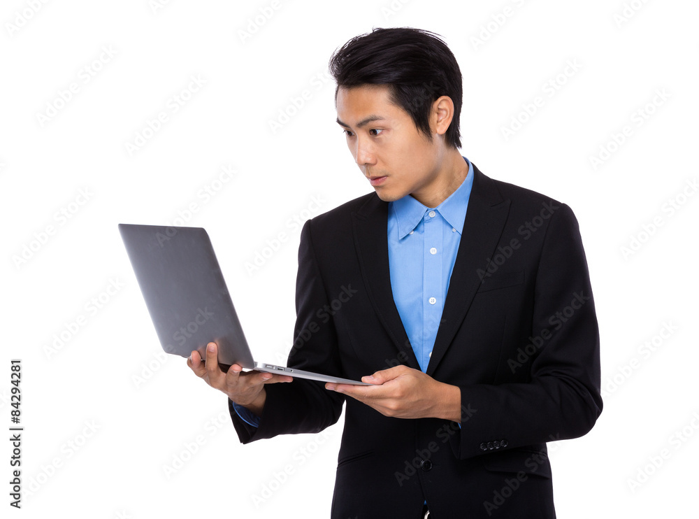 Young businessman use of the notebook computer Young businessman use of the notebook computer