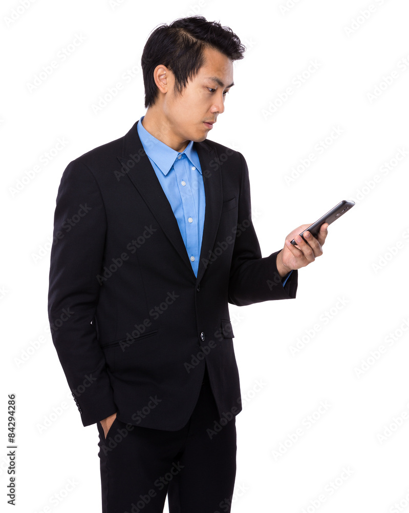 Businessman read the message on cellphone Businessman read the message on cellphone