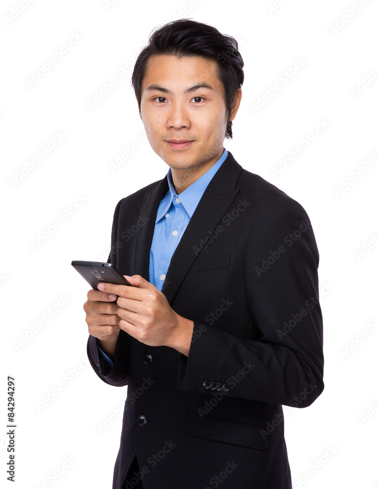 Asian businessman hold with cellphone Asian businessman hold with cellphone