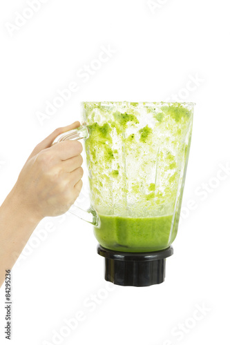 Green smoothie in a mixer jar