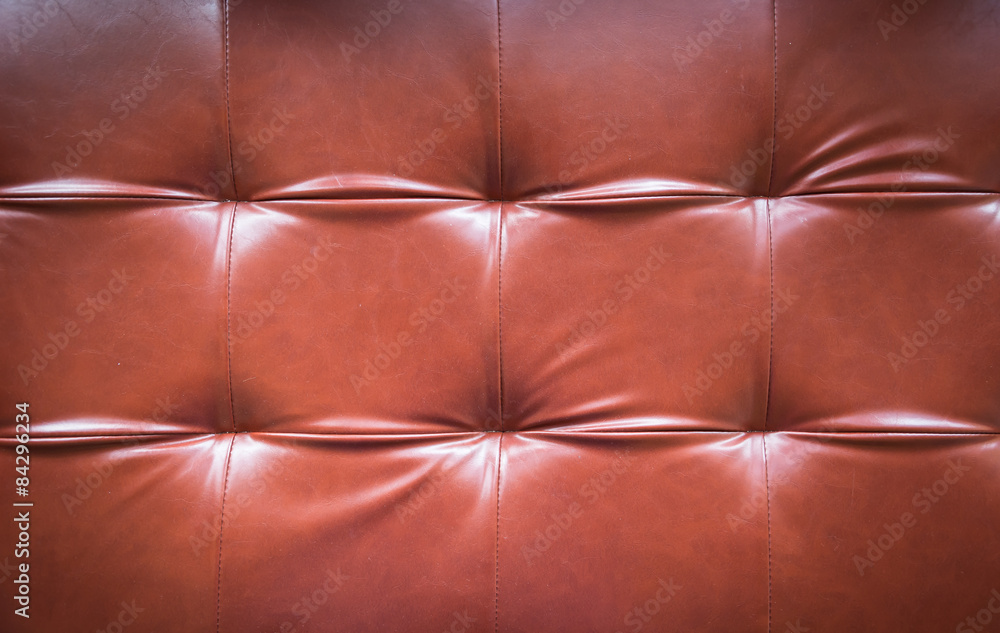 Naklejka premium red leather sofa background