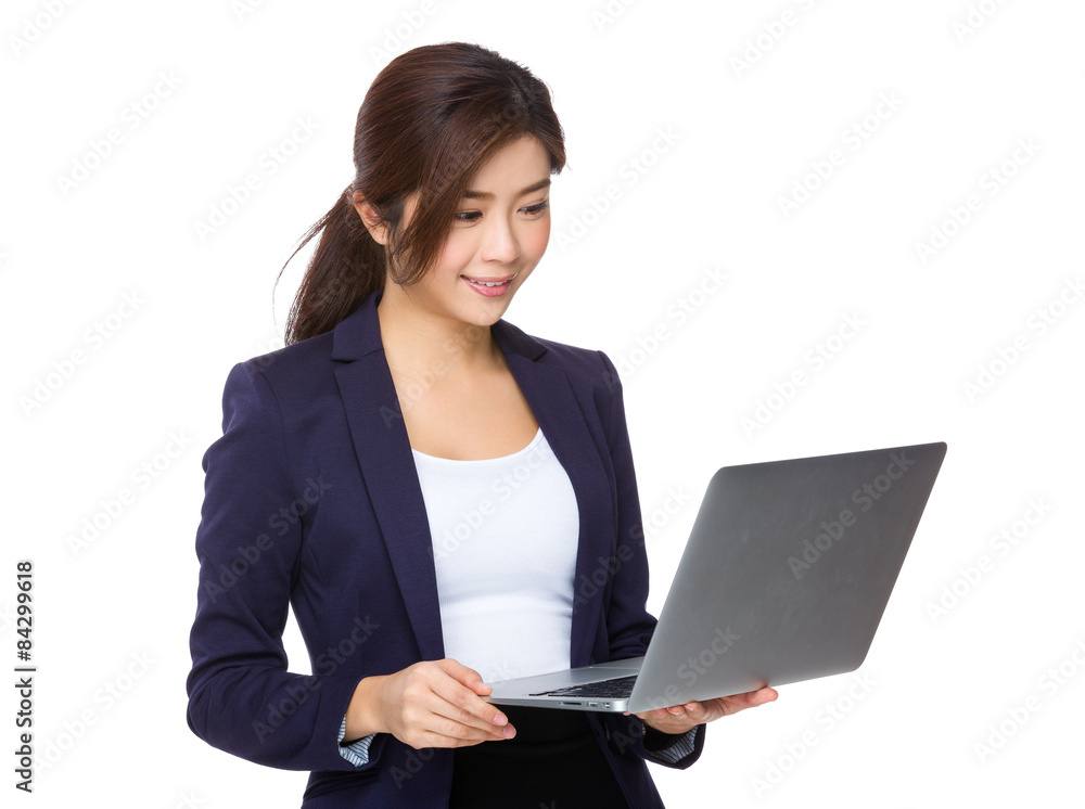 Young businesswoman read on notebook computer Young businesswoman read on notebook computer
