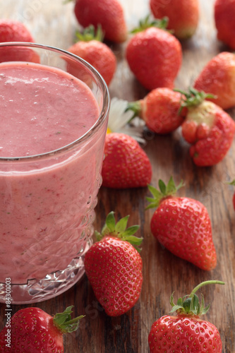 A glass of freshly prepared, delicious strawberry milkshake.