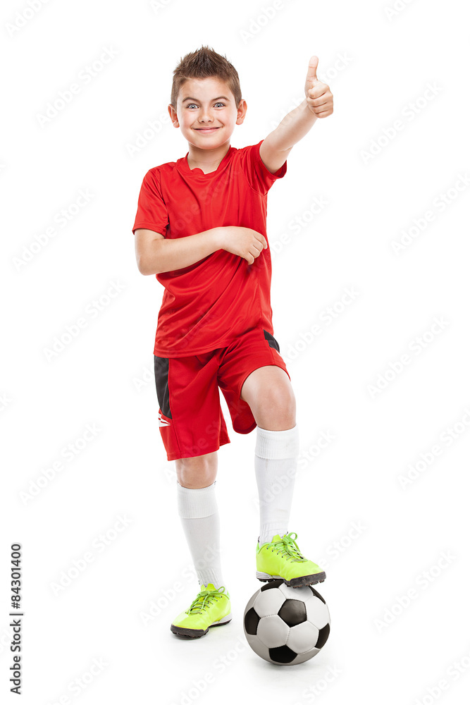 standing young soccer player with football