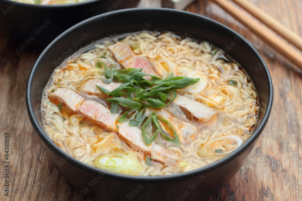 Bowl of oriental noodle and pork soup. Bowl of oriental noodle and pork soup.