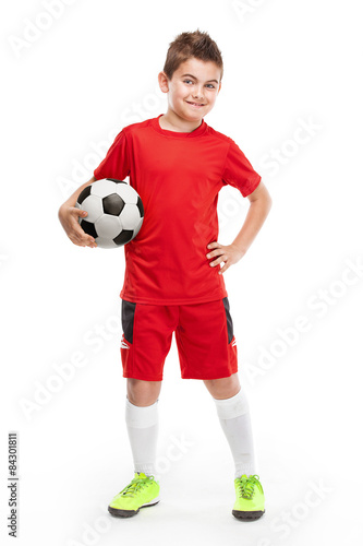 Fototapeta Naklejka Na Ścianę i Meble -  standing young soccer player holding football