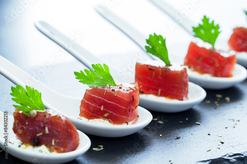 Fototapeta Naklejka Na Ścianę i Meble -  Tuna appetizers on ceramic spoons.