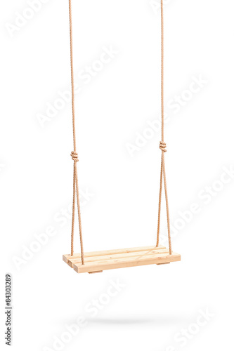 Wwooden swing hanging on a couple of ropes photo