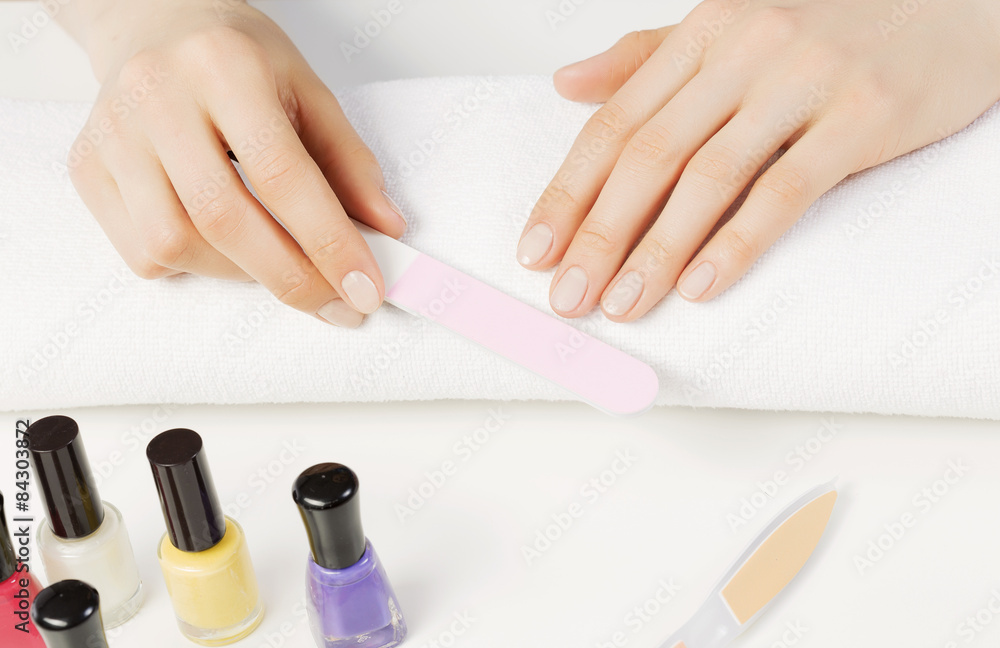 Woman using nailfile Woman using nailfile