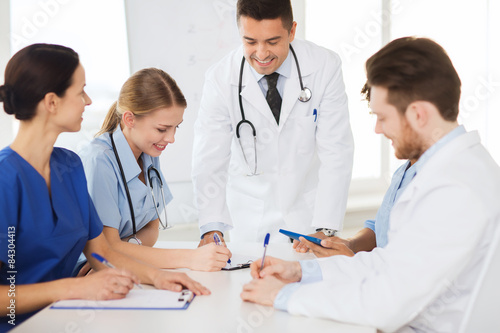 group of happy doctors meeting at hospital office