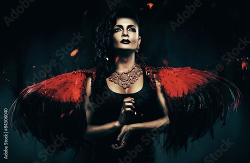dark angel transvestite with red wings photo