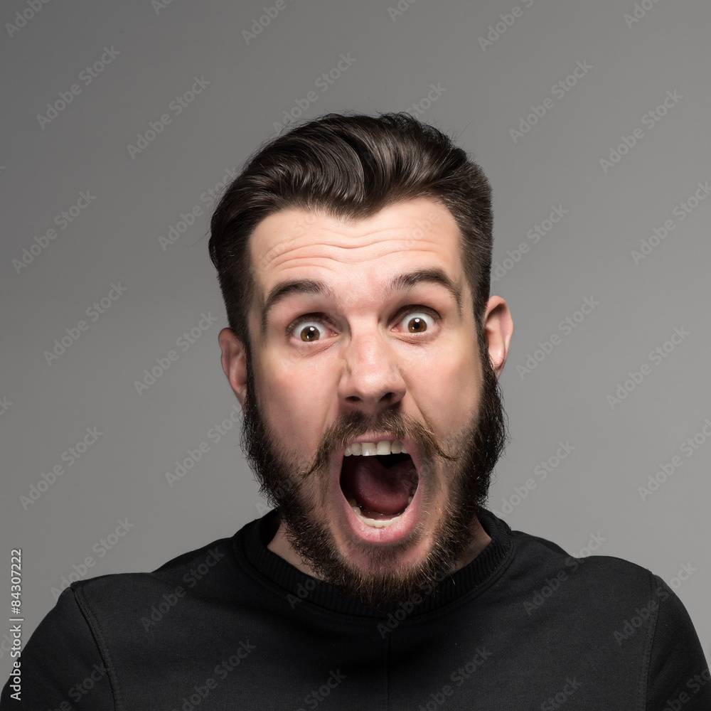 Portrait of a young surprised businessman with opened mouth Portrait of a young surprised businessman with opened mouth