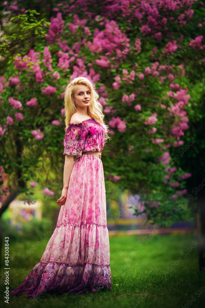 Beautiful young woman in spring garden