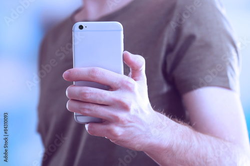 Man using mobile smart phone close-up