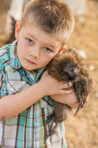 Boy Carrying Chicken