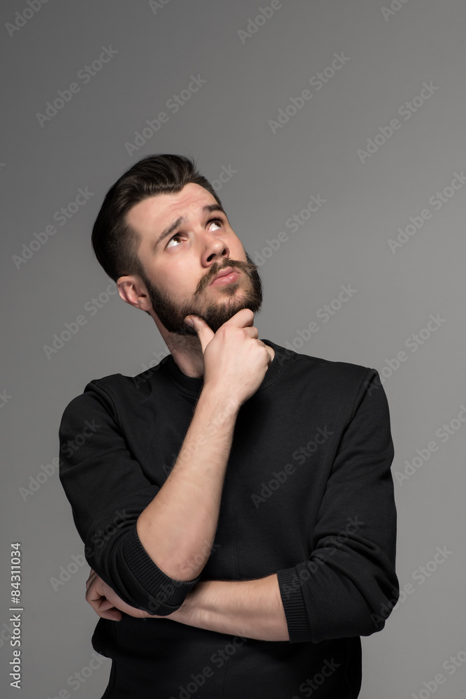 Fashion portrait of young man in black 