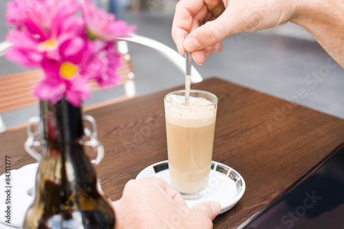 drinking coffee on a terrace
