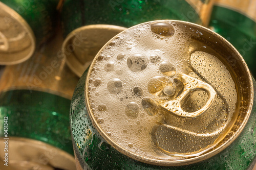 Close up cold   can beer with foam.