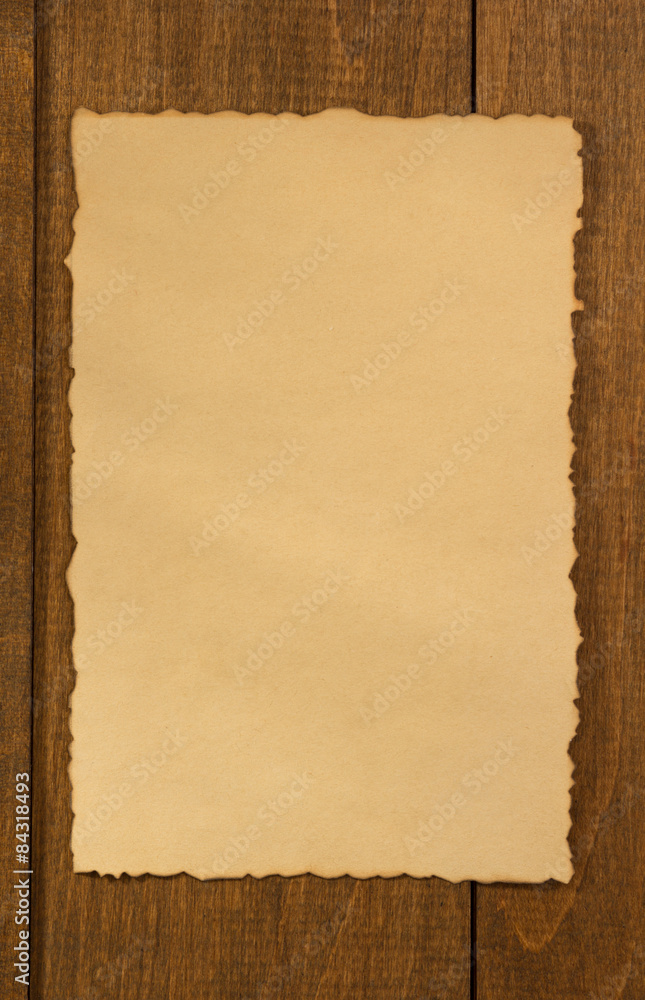 wrinkled note paper on wood