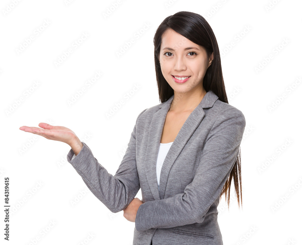 Young businesswoman with hand showing something Young businesswoman with hand showing something