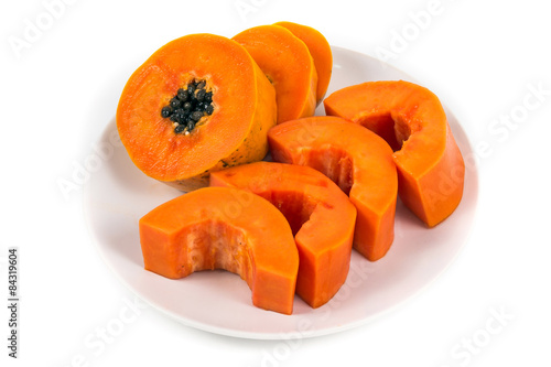 Isolated ripe papaya in the white dish