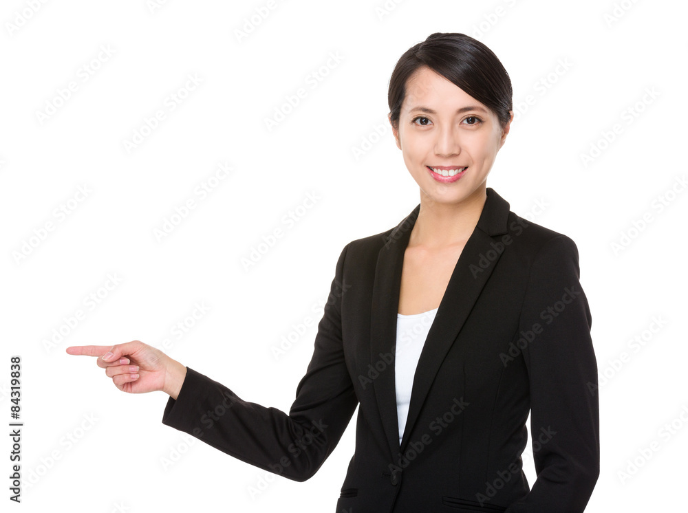 Young businesswoman with finger point aside Young businesswoman with finger point aside