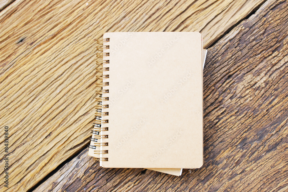 Notebook on wooden table Notebook on wooden table