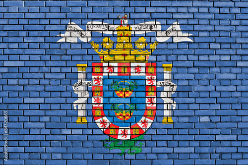 flag of Melilla painted on brick wall