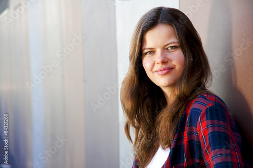 Girl city portrait. Woman smiling outside in evening light by th Free Download Girl city portrait. Woman smiling outside in evening light by th - GFXLoad
