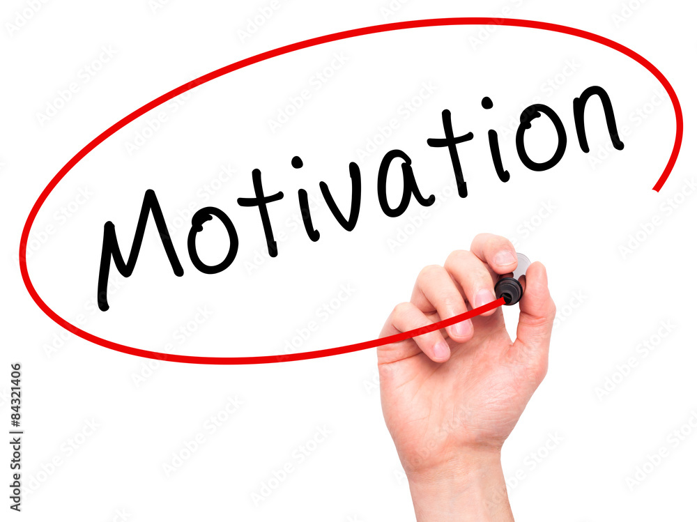 Man Hand writing Motivation with marker. Man Hand writing Motivation with marker.