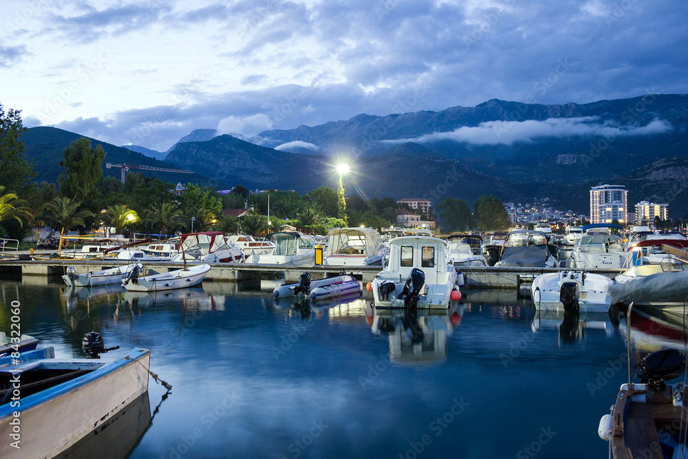  Montenegro: Night view with boats on sea front of Budva 