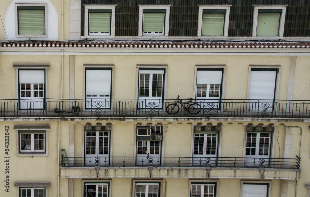 Bicycle on Balcony of Apartment Block