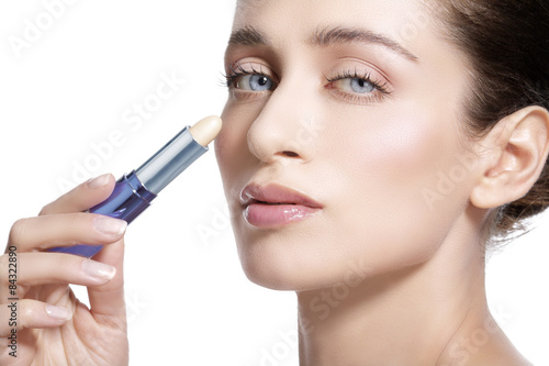  beautiful young woman model with perfect toned skin. Concealer