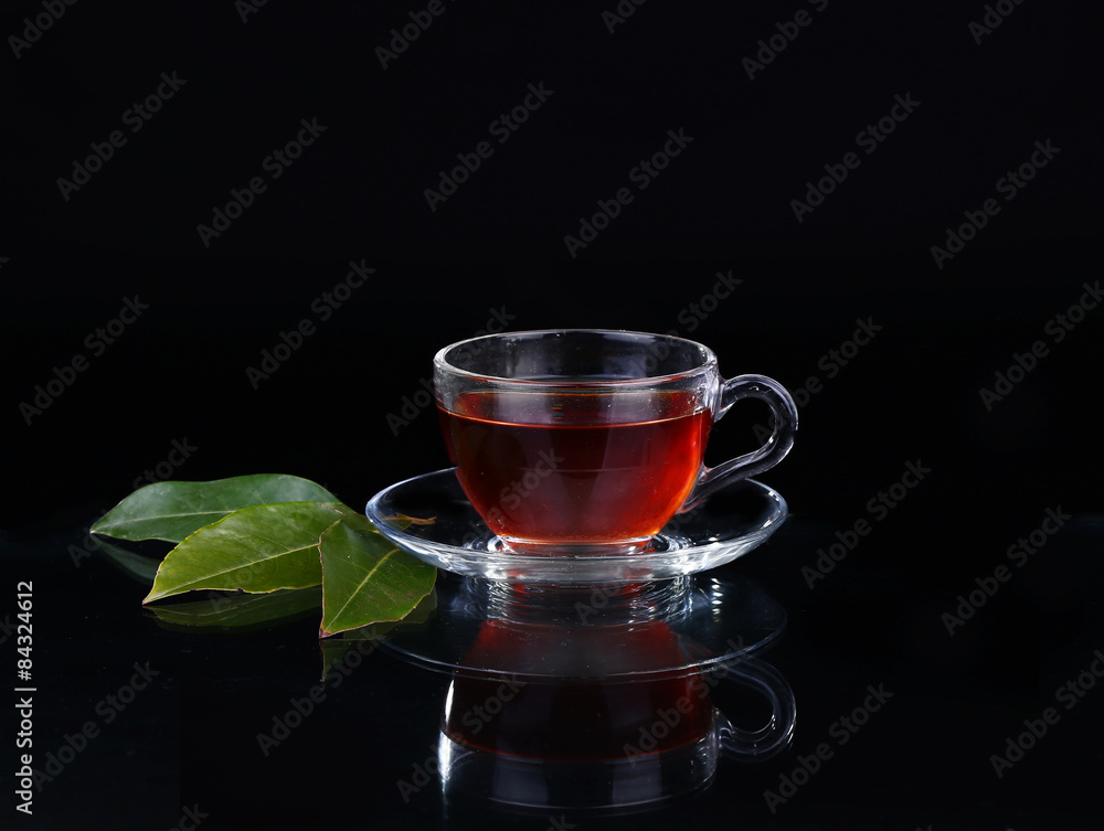 Glass cup of tea on black background. Glass cup of tea on black background.