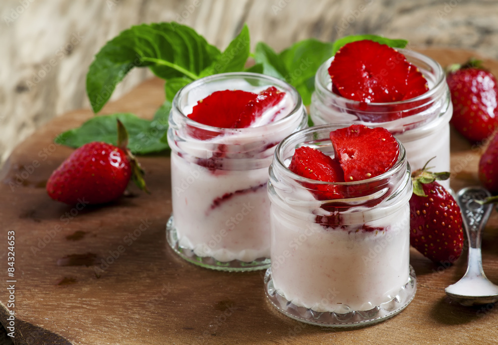 Homemade strawberry yogurt with fresh wild strawberries and mint Homemade strawberry yogurt with fresh wild strawberries and mint