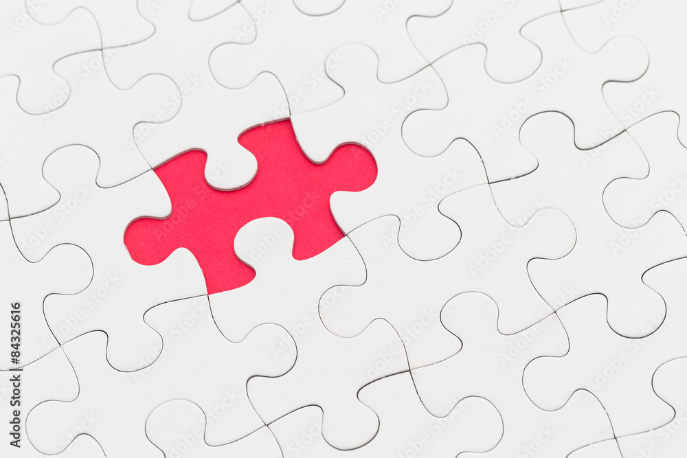 Plain white jigsaw puzzle on Red background Plain white jigsaw puzzle on Red background