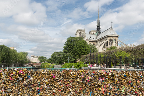 Love padlocks at bridge over river Seine in Paris, France