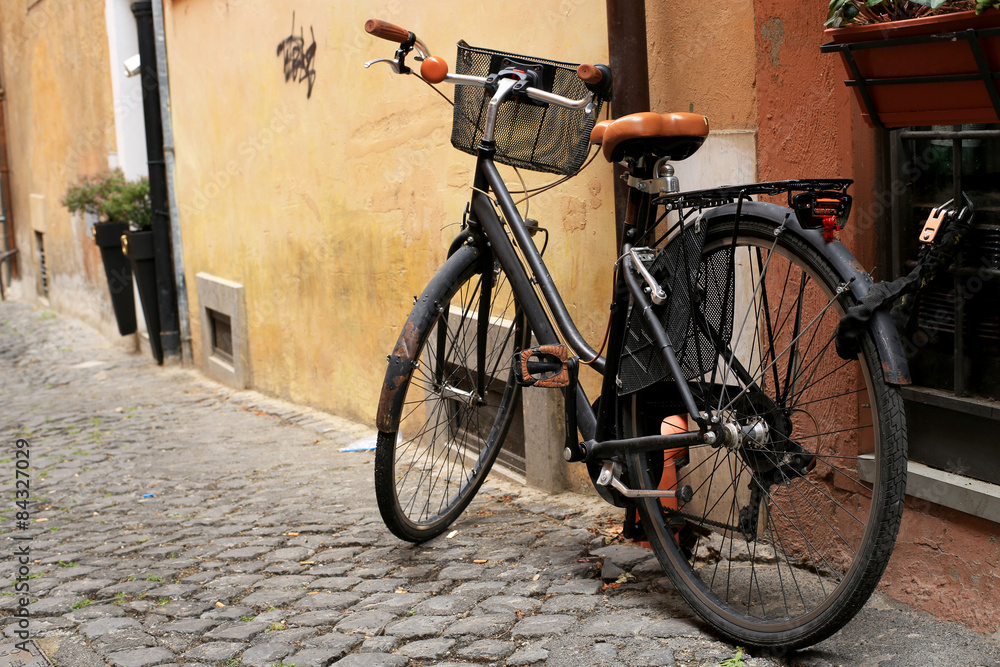 Black classic bike on a Roman street