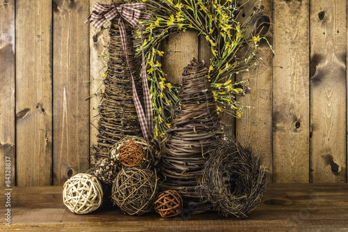 wicker crafts made from twisted sticks on wood background