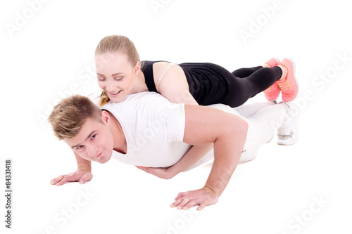 workout and love concept - young muscular man doing push ups wit