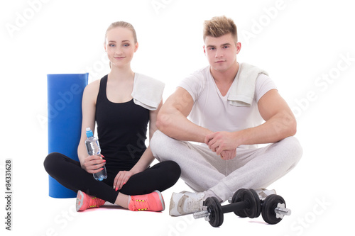 muscular man and slim woman relaxing after training isolated on