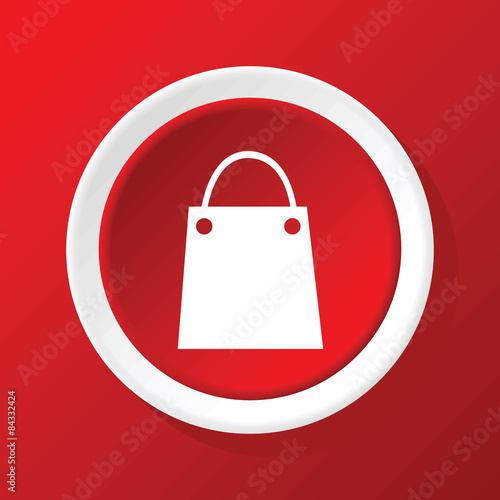 Shopping bag icon on red