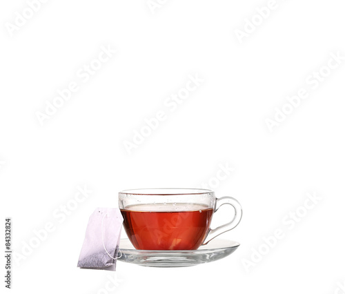 Cup of tea with teabag on white background